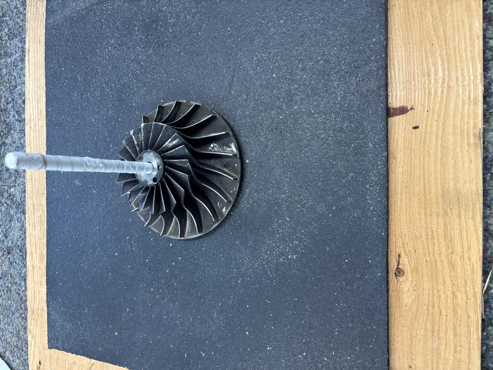 Custom rotating jig built to hold fin fan impellers for dry ice cleaning