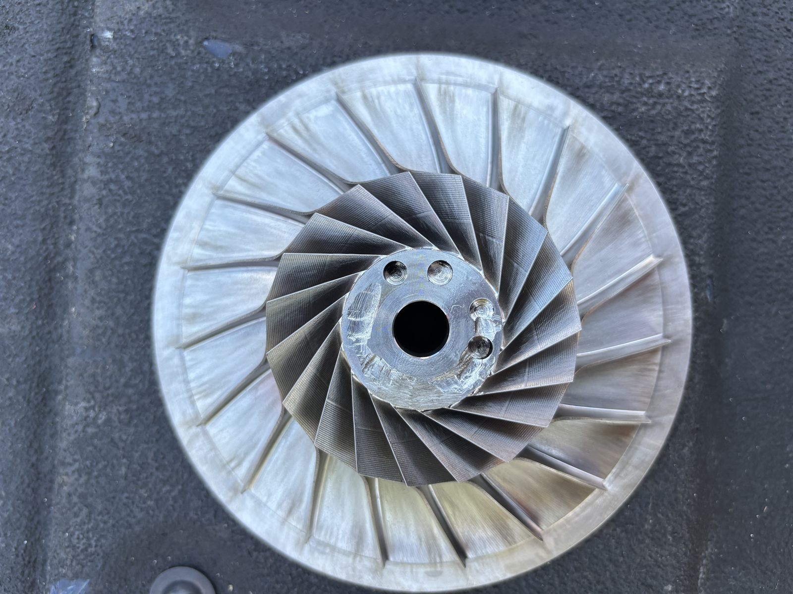 Fin fan impeller after dry ice cleaning, blades stripped to clean parent metal